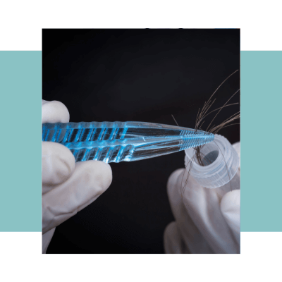 An image of a person putting hair strands in a test tube